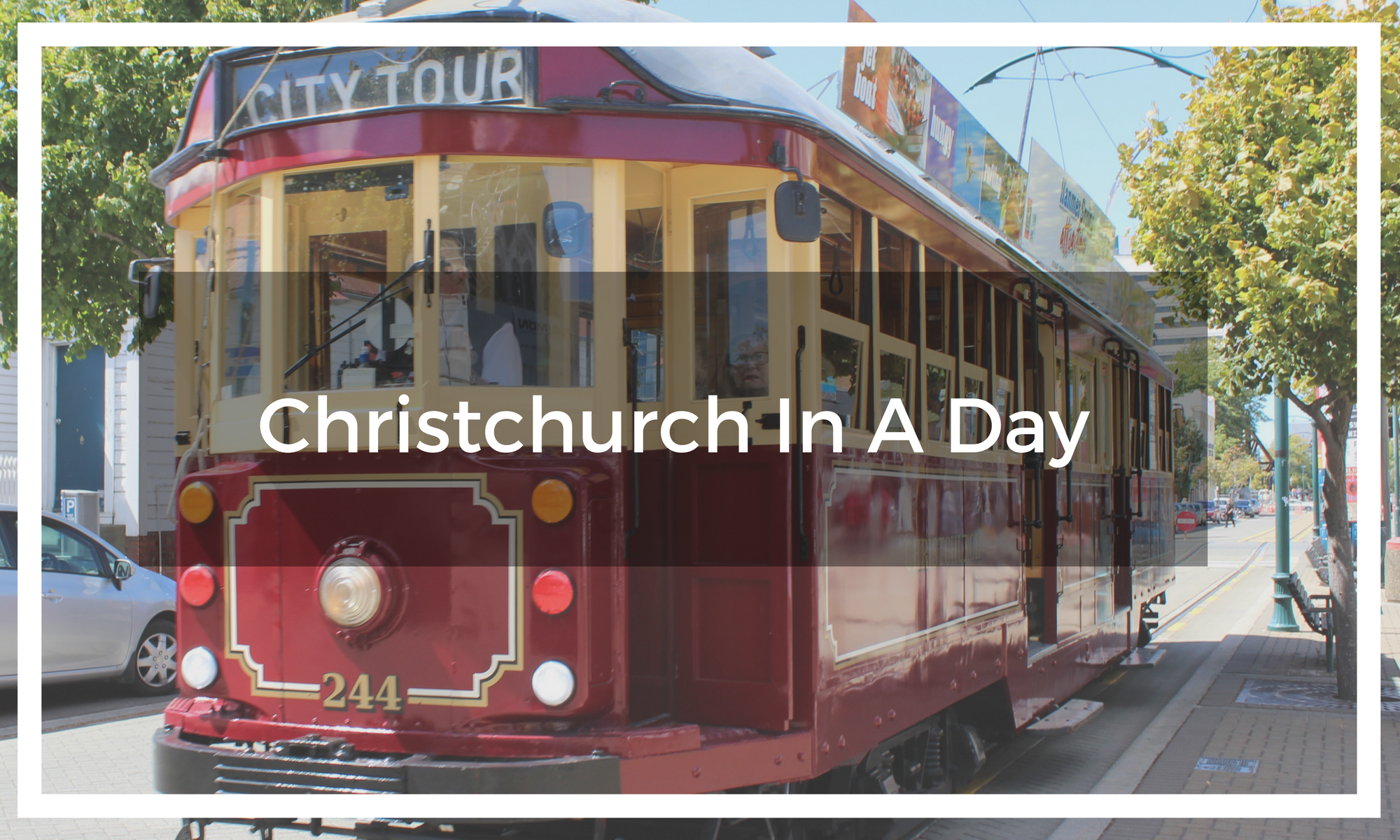 Title text overlay image of the Christchurch city tour tram on a street in New Zealand